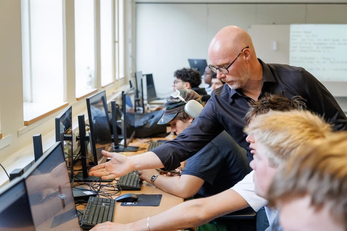 Students and teachers in a modern classroom setting using digital devices, representing Responsible AI Nordic education initiatives.