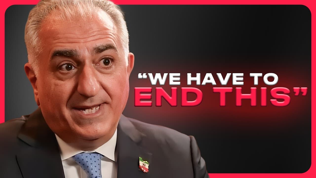 Reza Pahlavi speaking at a table with a microphone