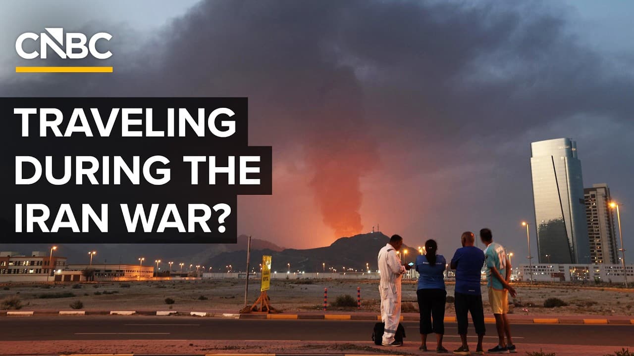Aerial view of Dubai skyline at sunset with Emirates airplanes at the airport