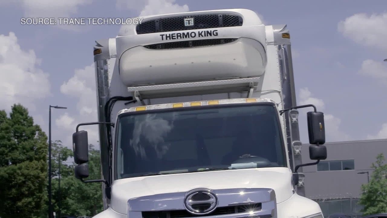 Dave, CEO of Trane Technologies, speaking into a microphone.