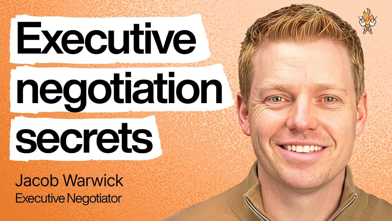 Jacob Warwick, professional negotiator, speaking into a microphone